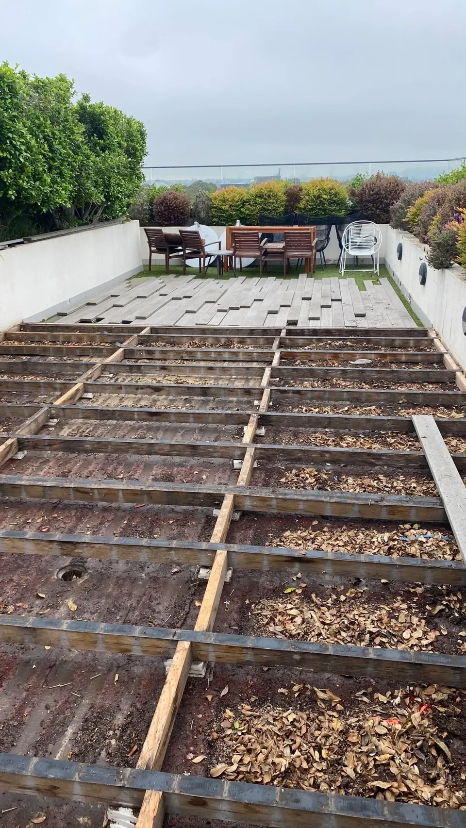 Failed balcony deck exposed before repair