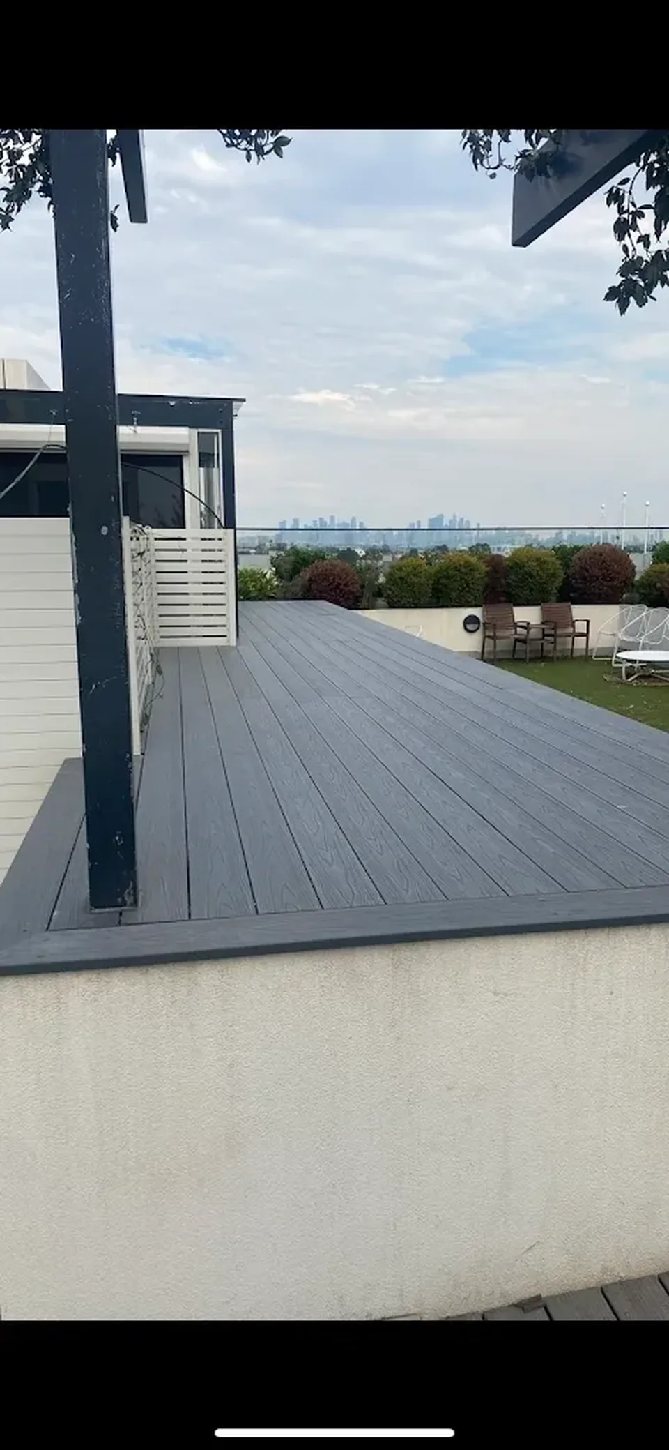 Completed grey terrace deck overlooking Melbourne